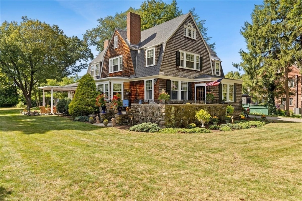 155 Mt Vernon Street Dedham, MA 02026 - Photo 4 of 50 a front view of a house with a yard