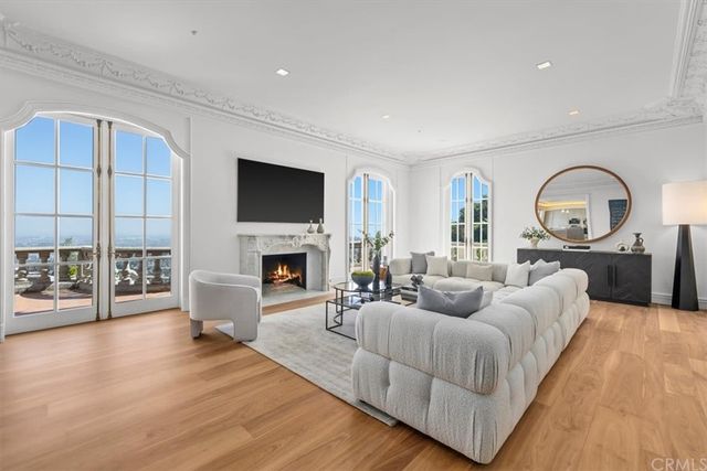 a living room with fireplace furniture and a flat screen tv