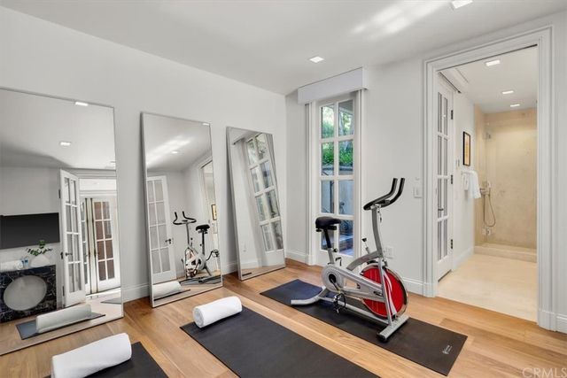 a bathroom with a double vanity sink toilet mirror and shower