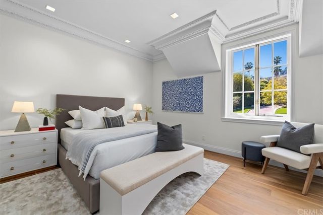 a bedroom with two beds and a window