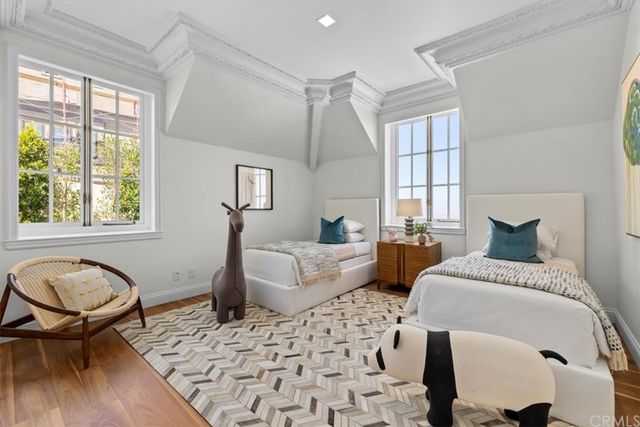 a bathroom with sink shower and natural light