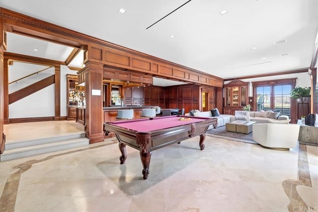 a kitchen with stainless steel appliances granite countertop a sink and a stove