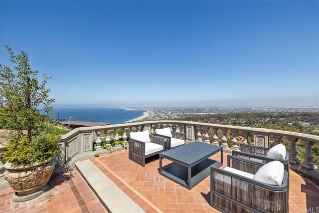an aerial view of a house with a ocean view
