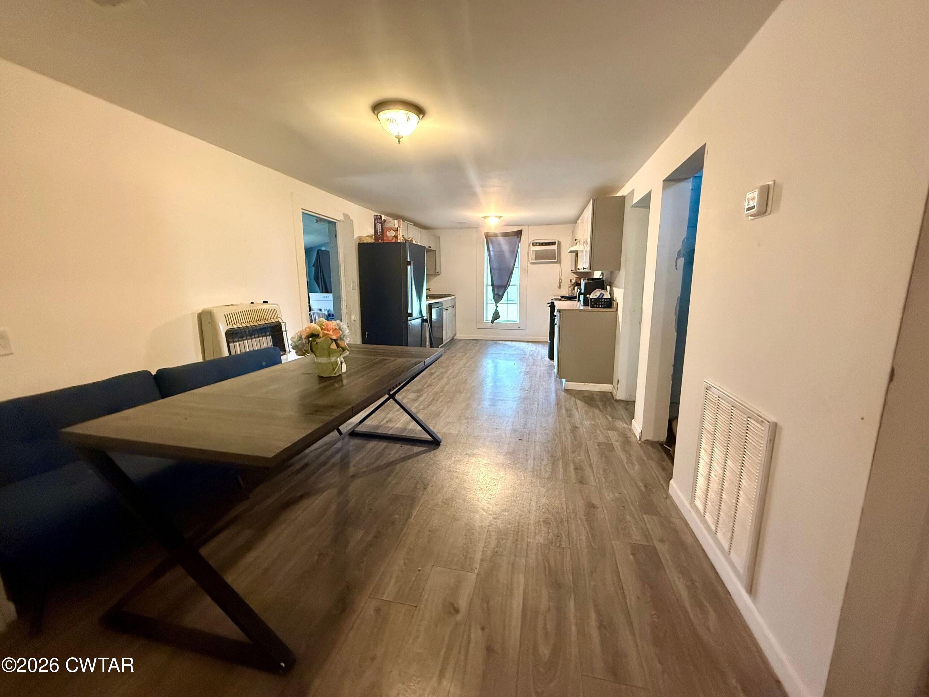 1935 Buster Collins Road Kenton, TN 38233 - Photo 5 of 18 a living room with furniture a flat screen tv and wooden floor