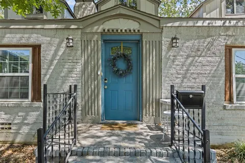 a front view of a house with a glass door