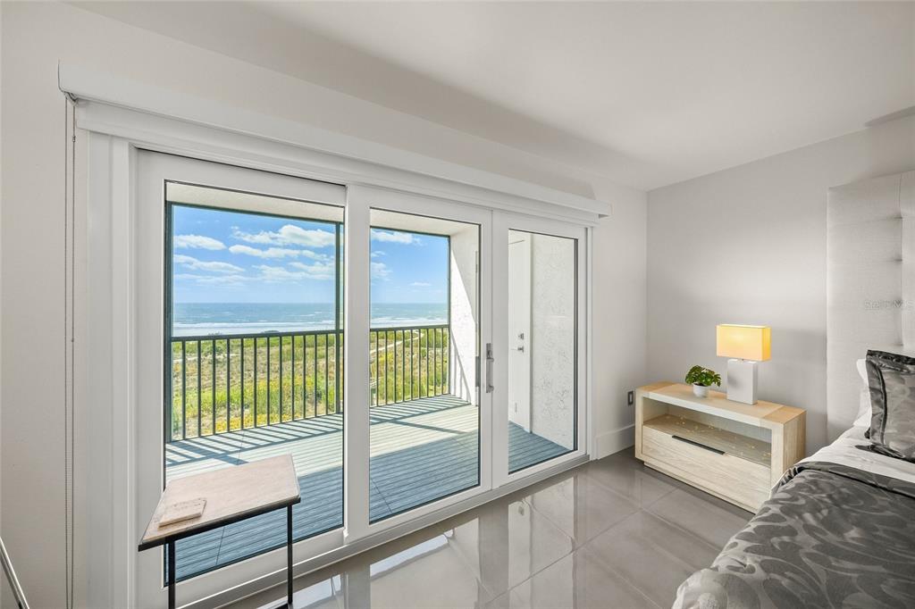 420 Beach Road, Unit 606 Sarasota, FL 34242 - Photo 25 of 83 a view of a bedroom with furniture and a window
