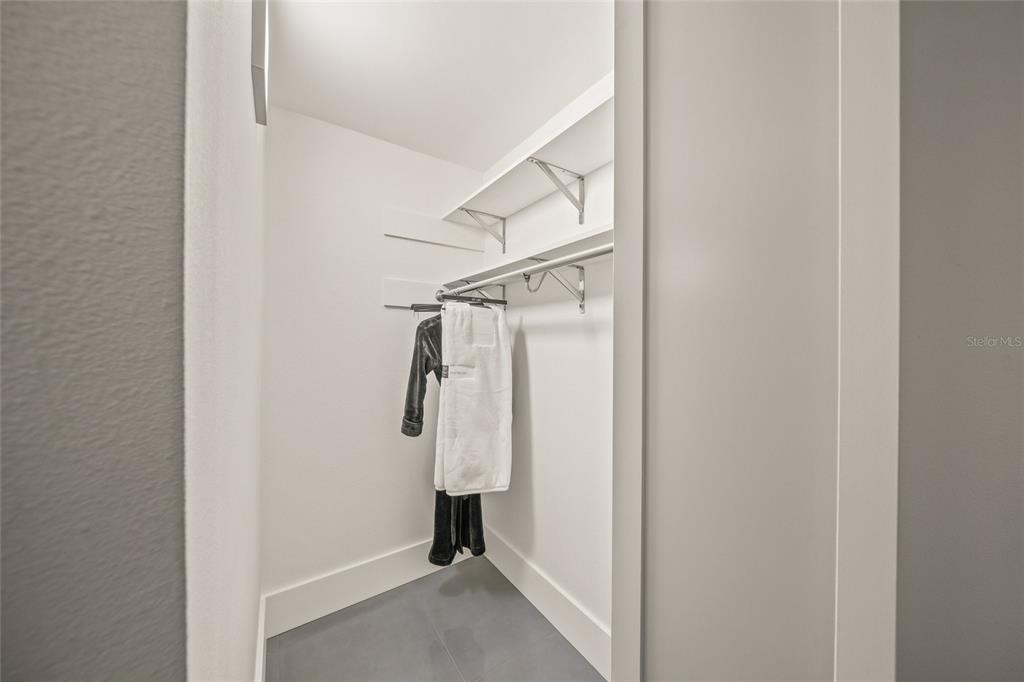 420 Beach Road, Unit 606 Sarasota, FL 34242 - Photo 36 of 83 a view of walk in closet with clothes