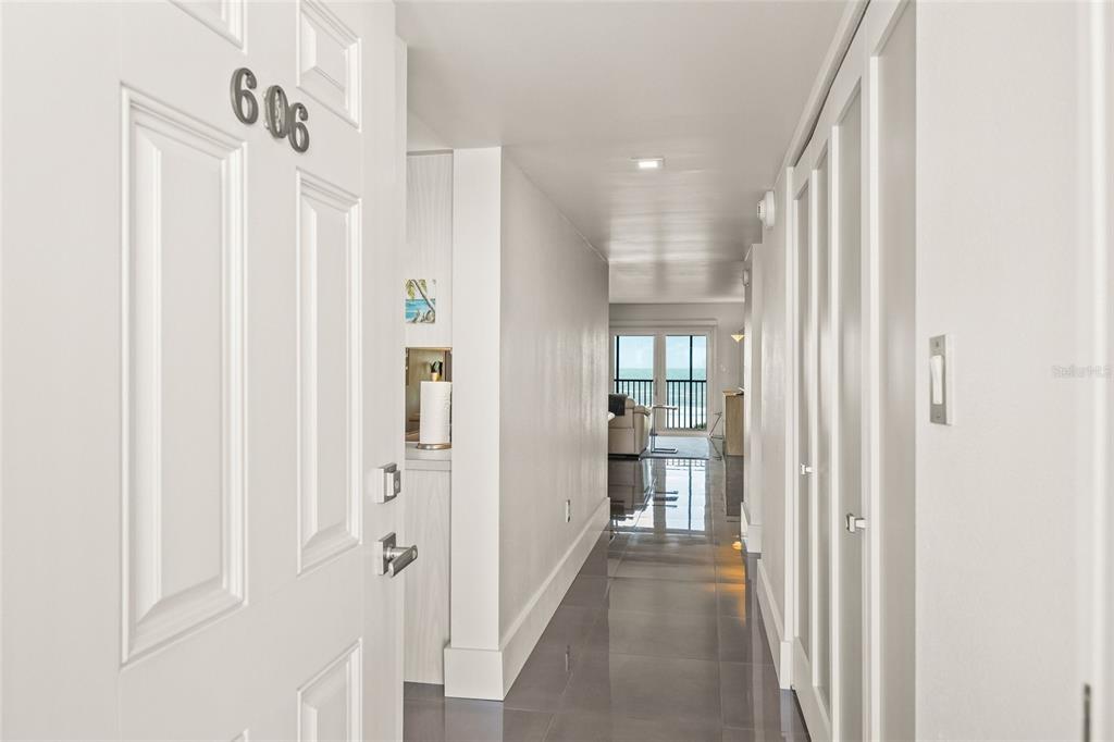 420 Beach Road, Unit 606 Sarasota, FL 34242 - Photo 4 of 83 a view of a hallway with wooden shelves