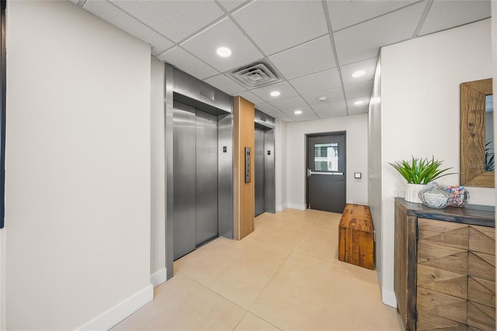 420 Beach Road, Unit 606 Sarasota, FL 34242 - Photo 44 of 83 a big room with closet and wooden floor