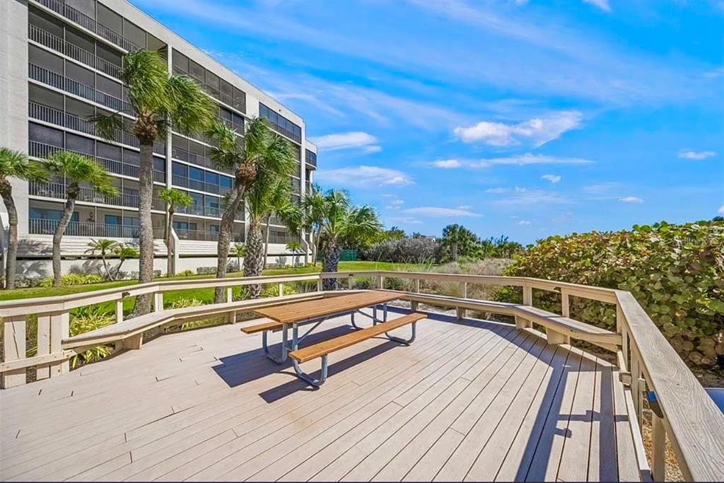 420 Beach Road, Unit 606 Sarasota, FL 34242 - Photo 55 of 83 a view of a balcony with wooden floor and city view