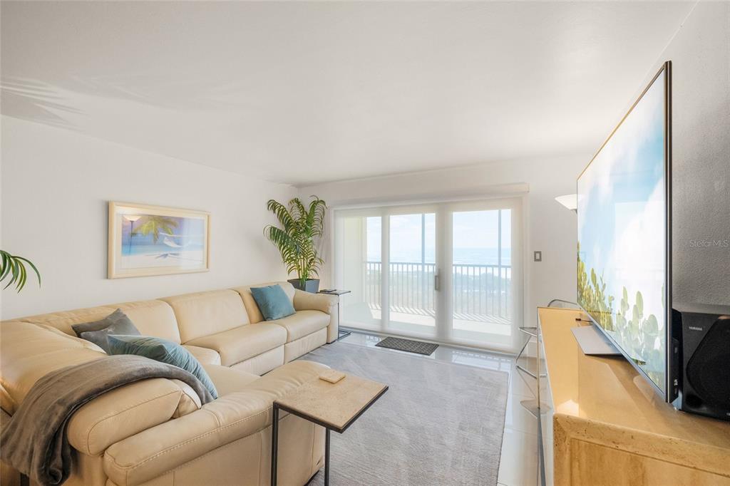 420 Beach Road, Unit 606 Sarasota, FL 34242 - Photo 8 of 83 a living room with furniture and a flat screen tv