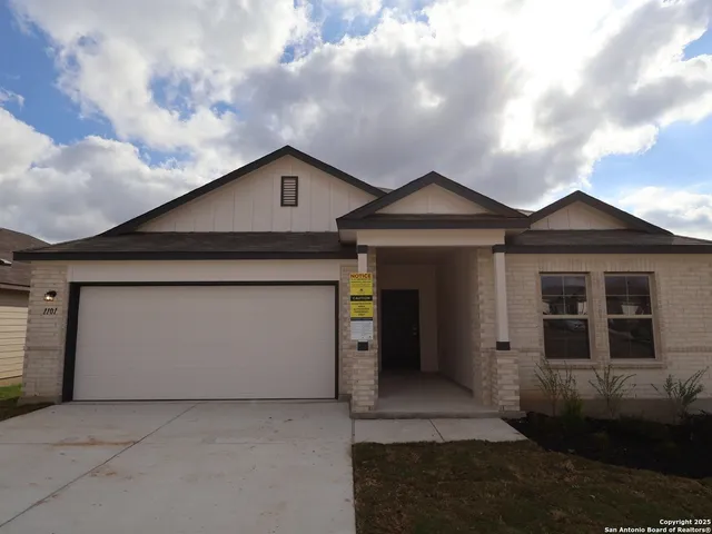 a front view of a house with garage