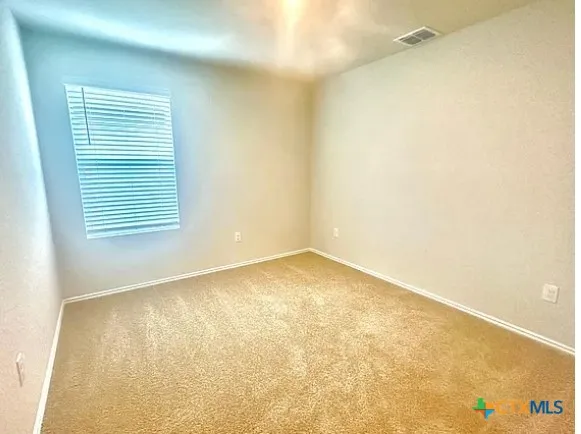 a white toilet sitting next to a shower