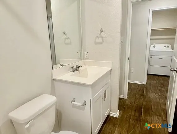a bathroom with a bathtub and a toilet