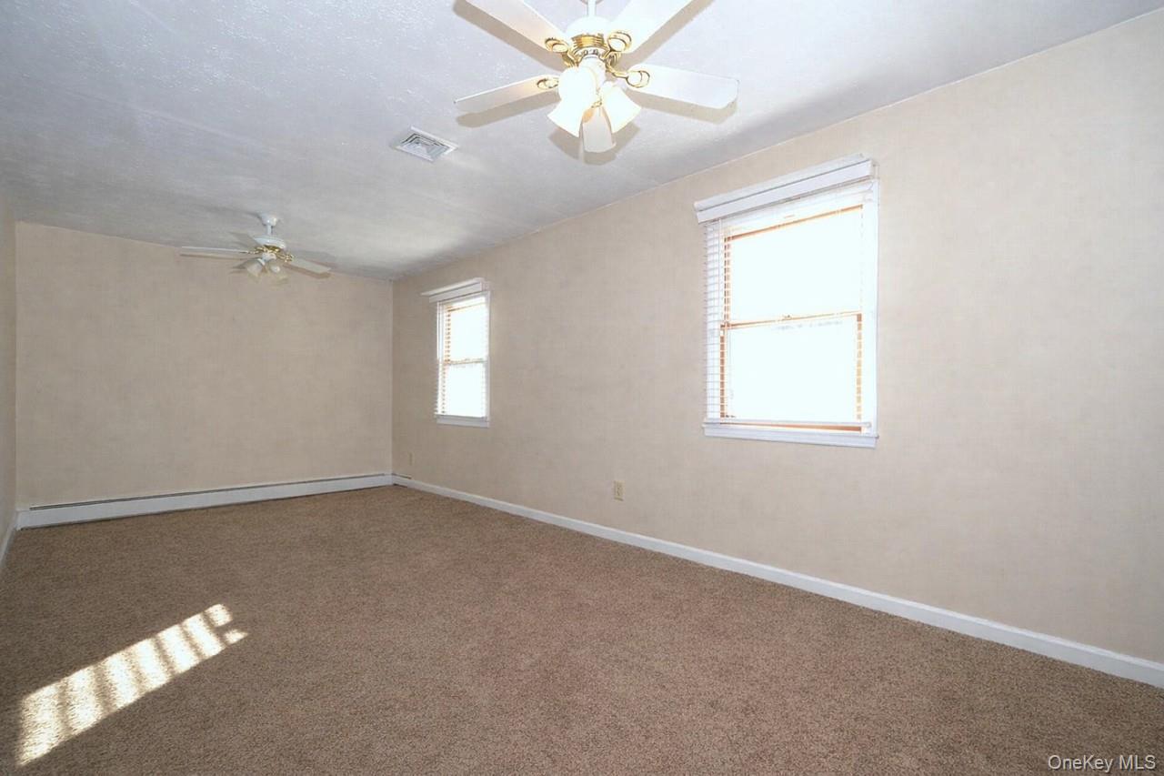 263 North Bicycle Path Selden, NY 11784 - Photo 12 of 23 Lower Level Den - virtually removed furniture