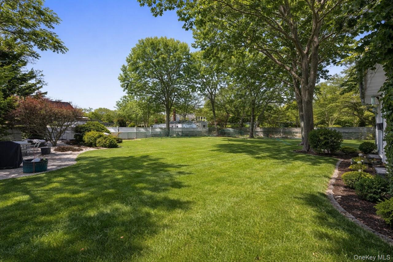263 North Bicycle Path Selden, NY 11784 - Photo 17 of 23 Virtually Updated - Fully fenced yard with electric and water line to where the above ground pool was and Detached Garage
