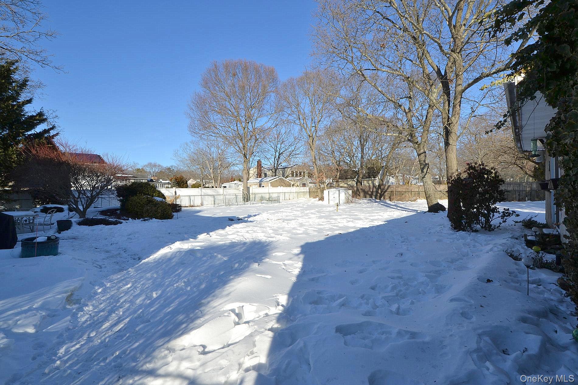 263 North Bicycle Path Selden, NY 11784 - Photo 18 of 23 Fully fenced yard to include pond with waterfall, detached garage, electric/water for future pool.