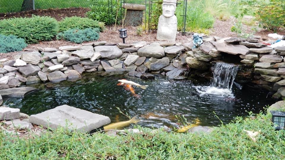 263 North Bicycle Path Selden, NY 11784 - Photo 19 of 23 Pond with waterfall