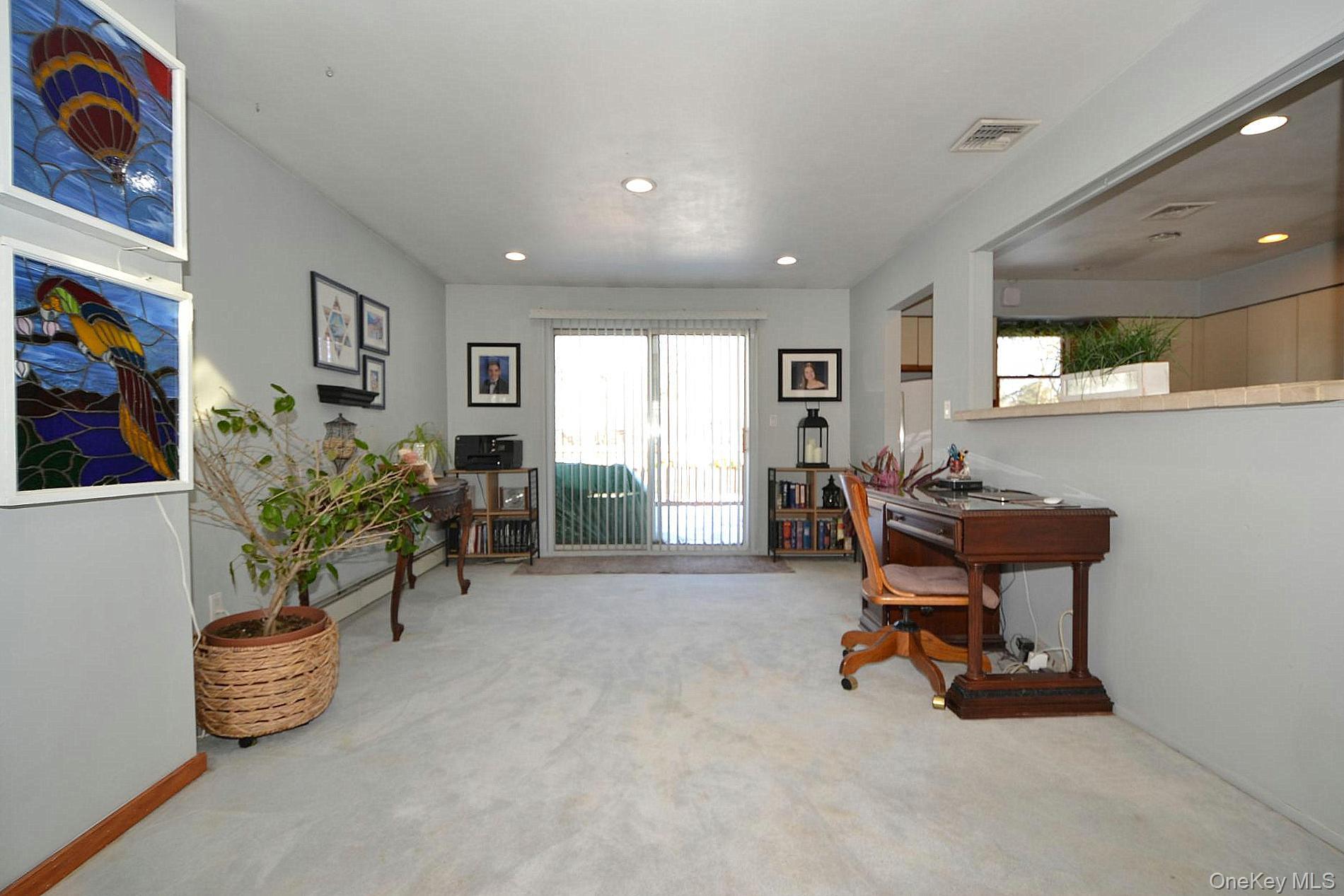263 North Bicycle Path Selden, NY 11784 - Photo 6 of 23 Upper Level Dining Area with Sliders to Deck