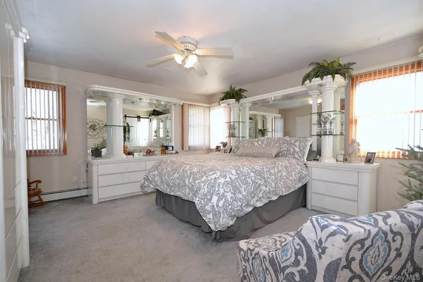 a bedroom with a bed furniture and window