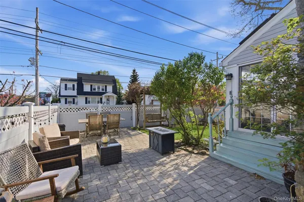 a outdoor space with patio furniture and potted plants