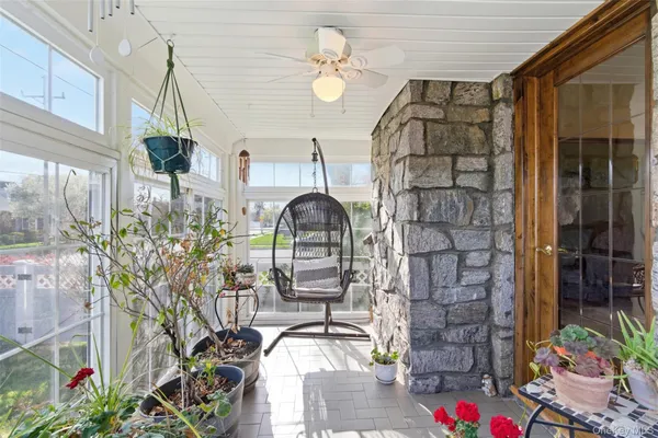 a front view of a house with outdoor seating