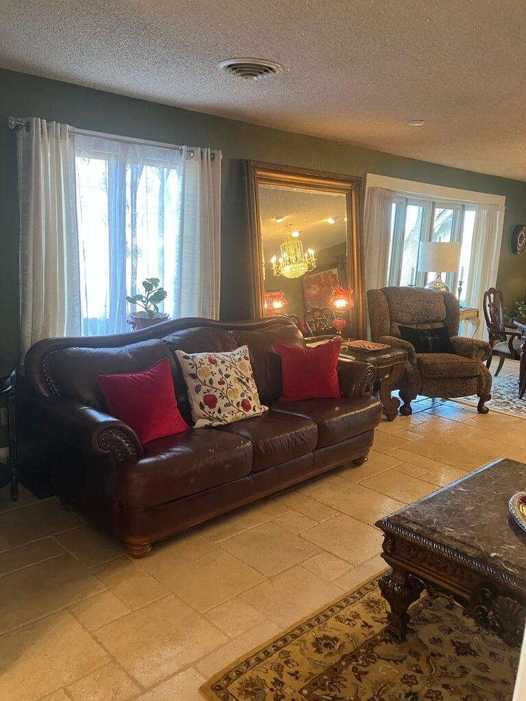 7303 Olton Road Plainview, TX 79072 - Photo 11 of 56 a living room with furniture and a window
