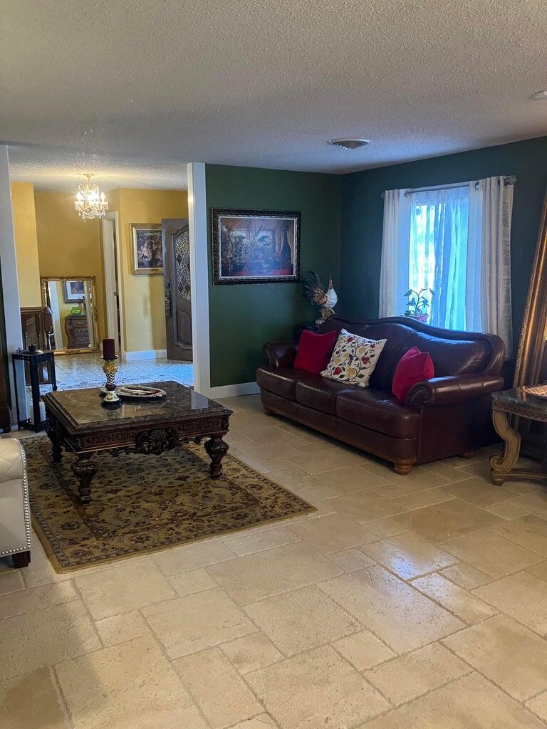 7303 Olton Road Plainview, TX 79072 - Photo 14 of 56 a living room with furniture and a flat screen tv