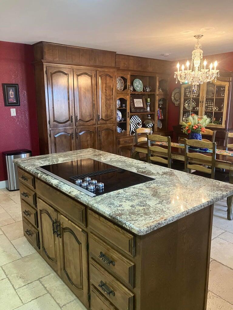7303 Olton Road Plainview, TX 79072 - Photo 16 of 56 a kitchen with sink and view kitchen
