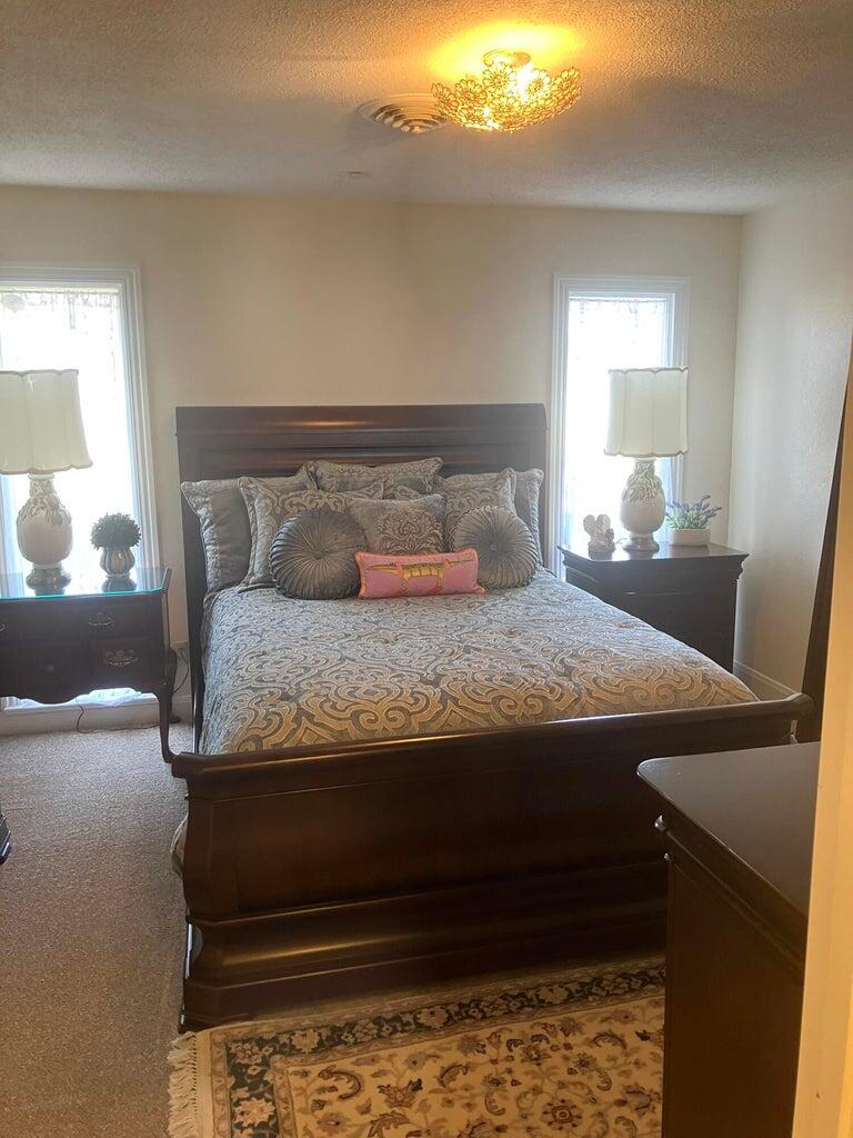 7303 Olton Road Plainview, TX 79072 - Photo 24 of 56 a bedroom with a bed and window
