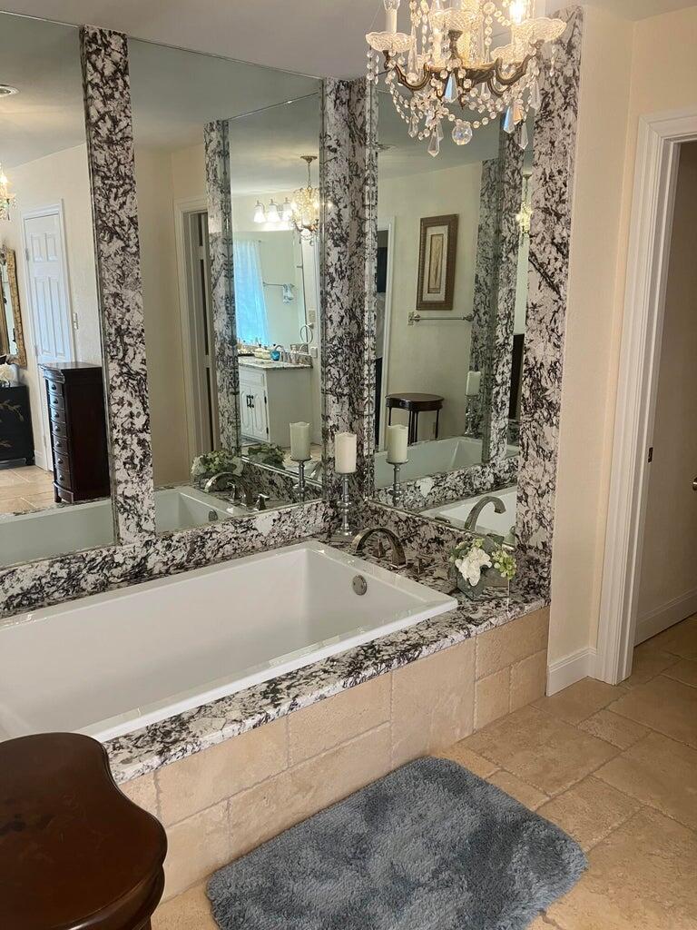 7303 Olton Road Plainview, TX 79072 - Photo 34 of 56 a bathroom with a bathtub and a sink