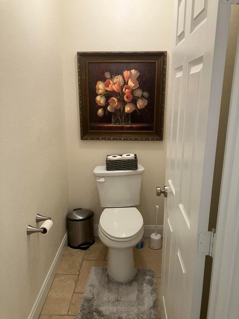 7303 Olton Road Plainview, TX 79072 - Photo 37 of 56 a bathroom with a toilet and a sink