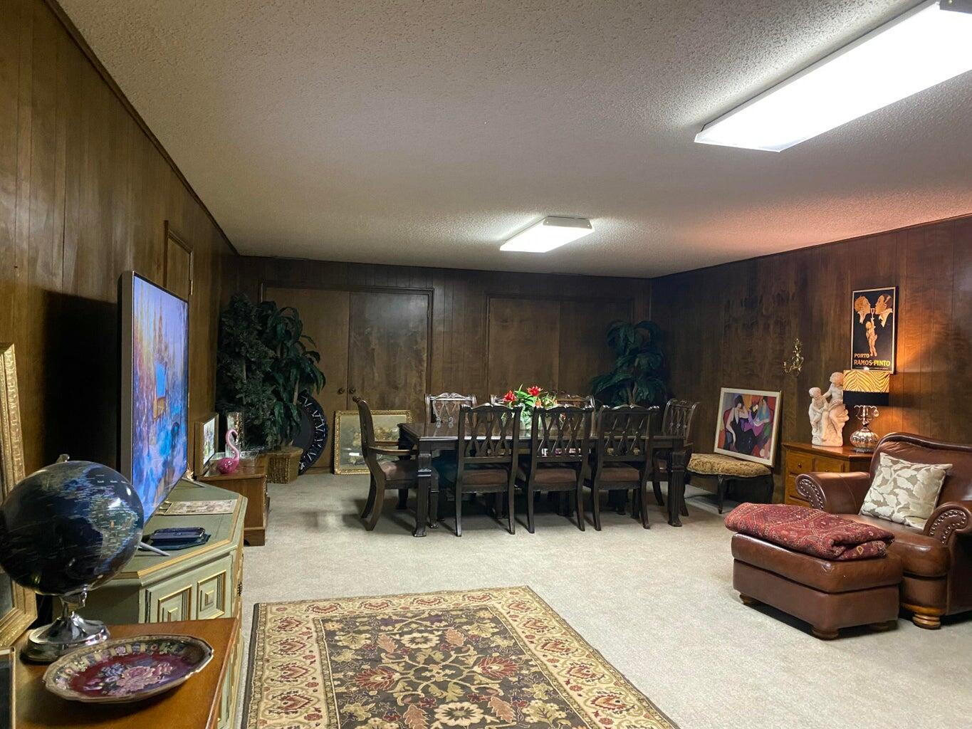 7303 Olton Road Plainview, TX 79072 - Photo 39 of 56 a living room with furniture and a flat screen tv