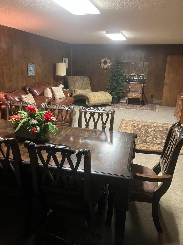 7303 Olton Road Plainview, TX 79072 - Photo 42 of 56 a view of a dining room with furniture and wooden floor