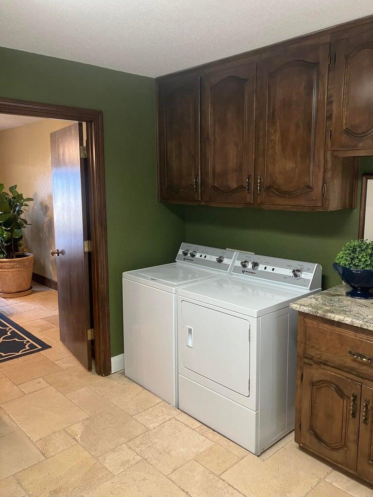 7303 Olton Road Plainview, TX 79072 - Photo 45 of 56 a utility room with dryer and washer