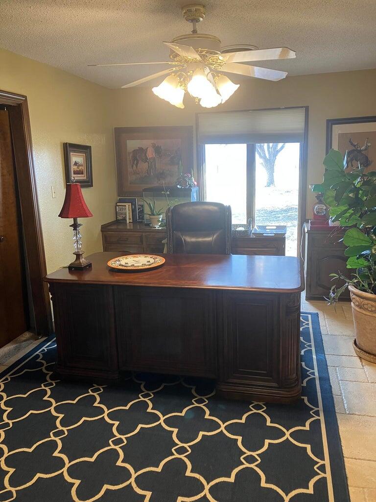 7303 Olton Road Plainview, TX 79072 - Photo 46 of 56 a living room with furniture and a fireplace