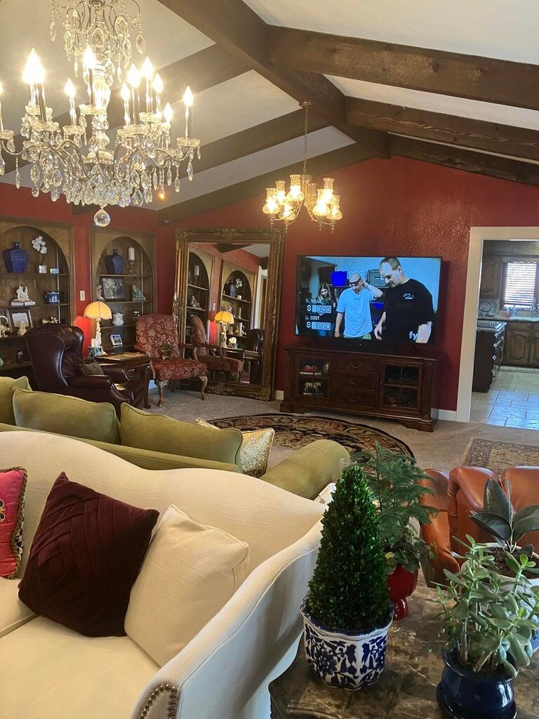 7303 Olton Road Plainview, TX 79072 - Photo 5 of 56 a living room with furniture and a flat screen tv
