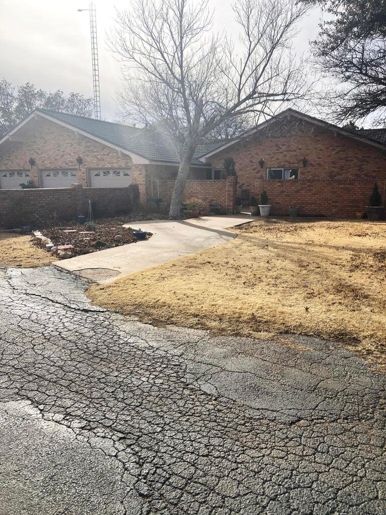 7303 Olton Road Plainview, TX 79072 - Photo 51 of 56 a view of large house with a yard