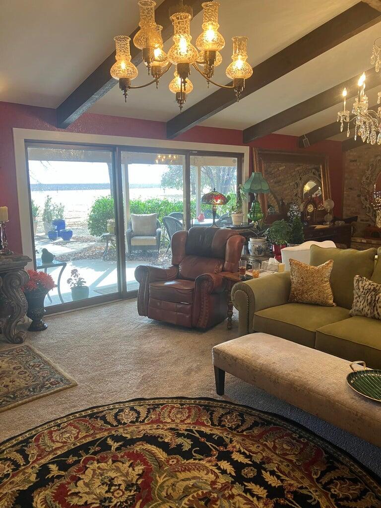 7303 Olton Road Plainview, TX 79072 - Photo 6 of 56 a living room with furniture and a large window