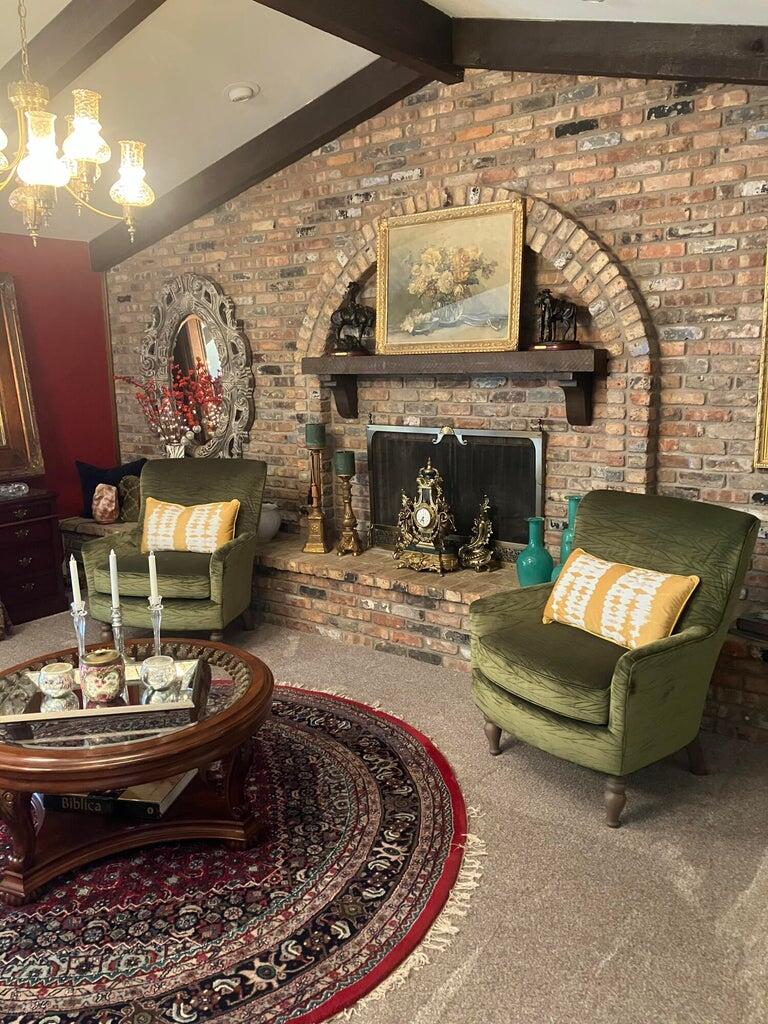 7303 Olton Road Plainview, TX 79072 - Photo 7 of 56 a living room with furniture and a fireplace