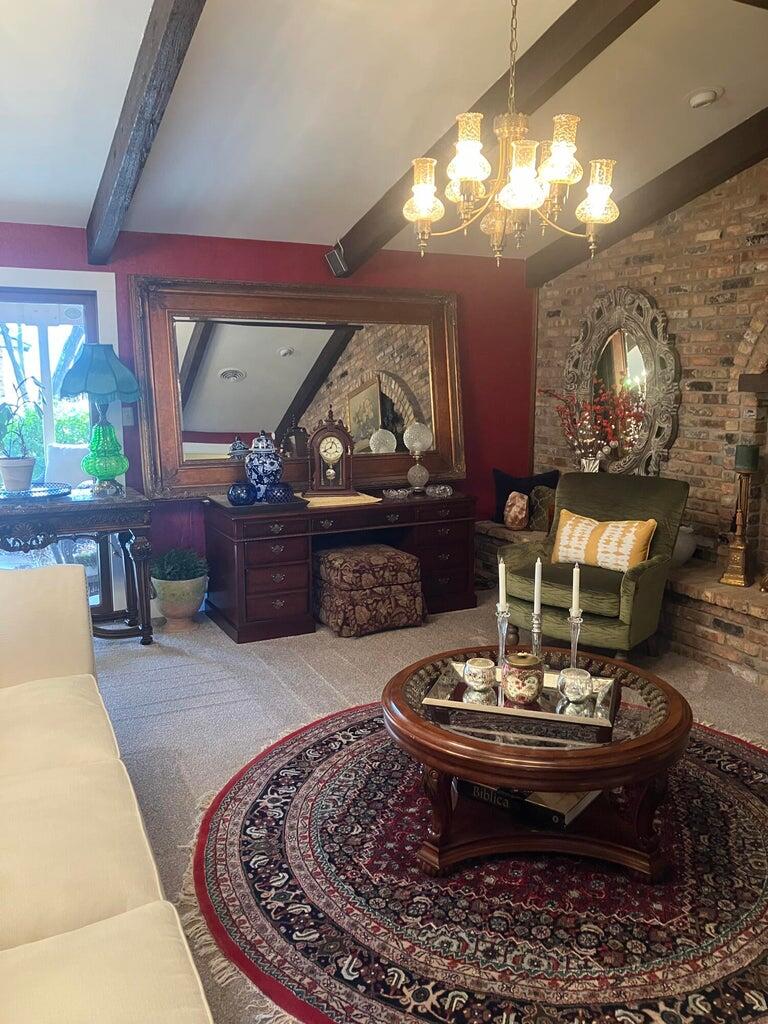 7303 Olton Road Plainview, TX 79072 - Photo 8 of 56 a room with furniture and a fireplace