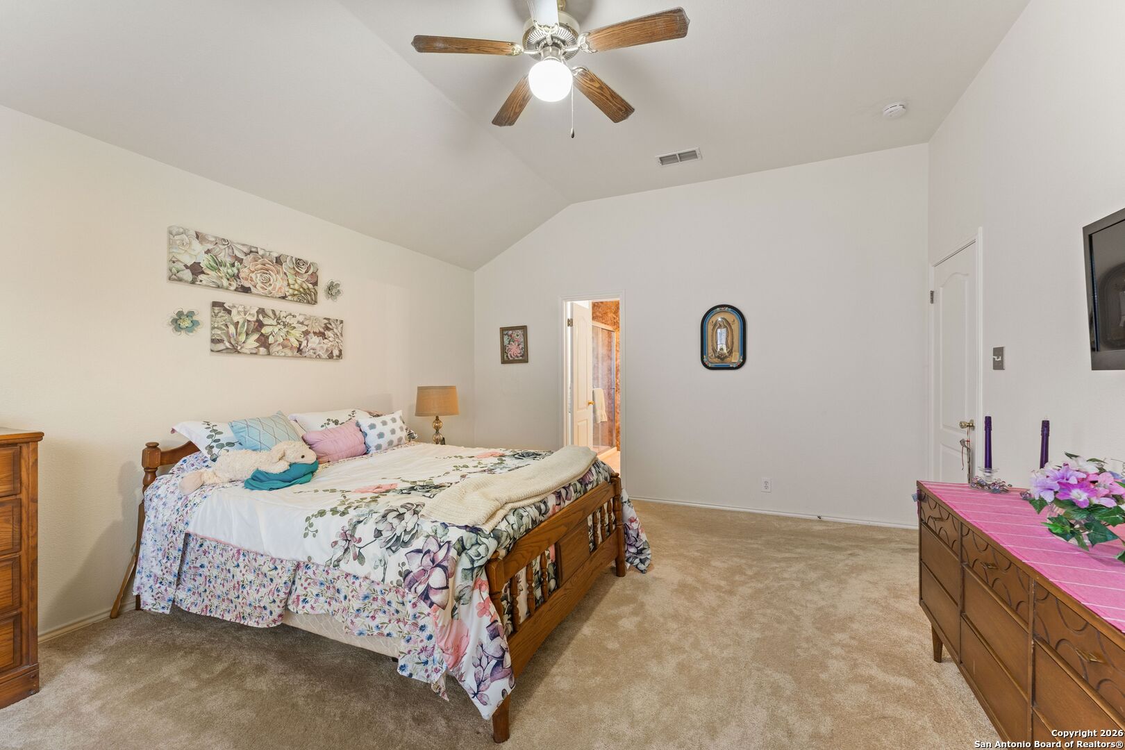 13127 Forum Universal City, TX 78148 - Photo 16 of 33 a bedroom with a bed and a chandelier