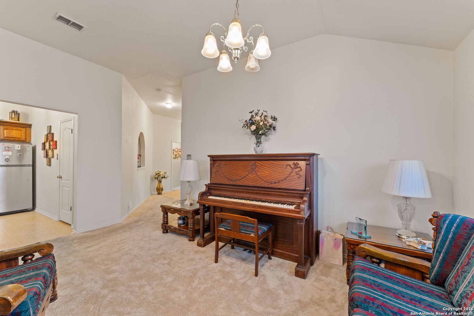13127 Forum Universal City, TX 78148 - Photo 22 of 33 a living room with furniture and a chandelier