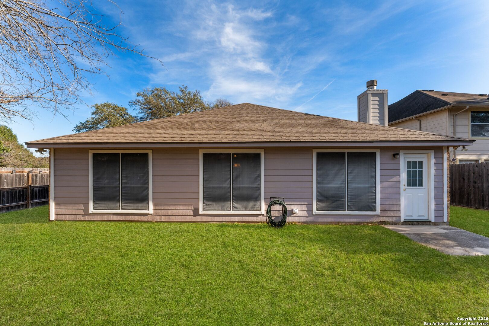 13127 Forum Universal City, TX 78148 - Photo 29 of 33 a front view of a house with a yard