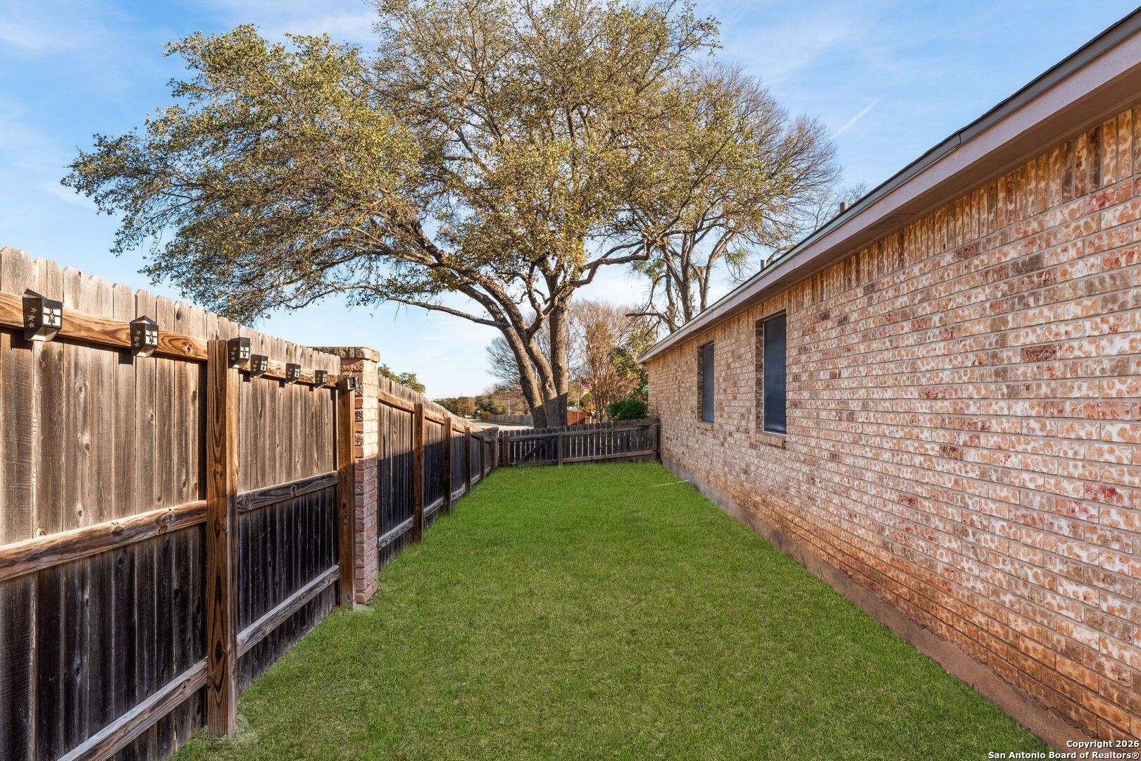13127 Forum Universal City, TX 78148 - Photo 32 of 33 a view of a backyard with wooden fence