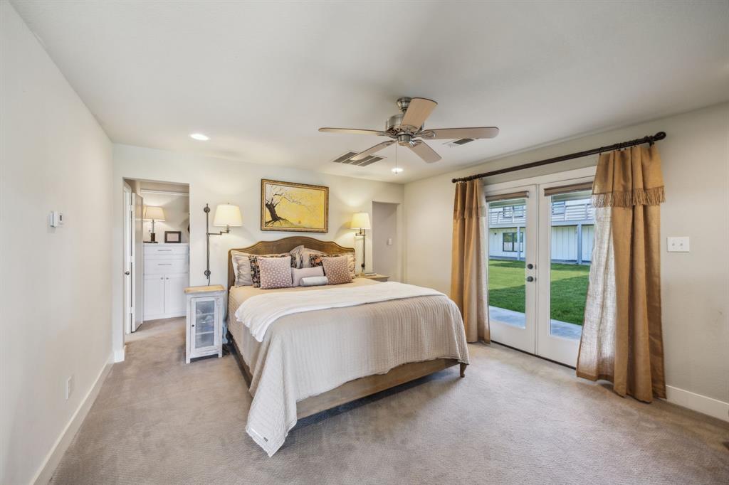 5905 Cr-1093 Celeste, TX 75423 - Photo 16 of 40 a spacious bedroom with a large bed and a chandelier