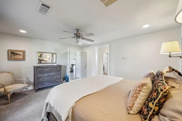 a bedroom with a bed and furniture