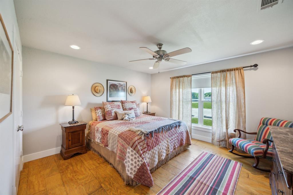 5905 Cr-1093 Celeste, TX 75423 - Photo 28 of 40 a bedroom with a bed and wooden floor