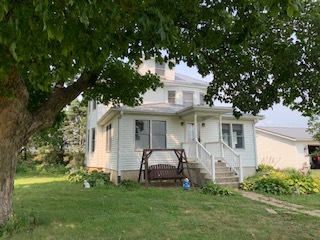 13182 Lyndon Road Morrison, IL 61270 - Photo 1 of 19 a front view of a house with a garden