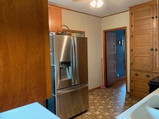 13182 Lyndon Road Morrison, IL 61270 - Photo 2 of 19 a kitchen with metallic refrigerator freezer and a dishwasher